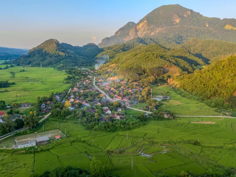 Wide mountain valley landscape in Laos for an exclusive multi-region private journey.