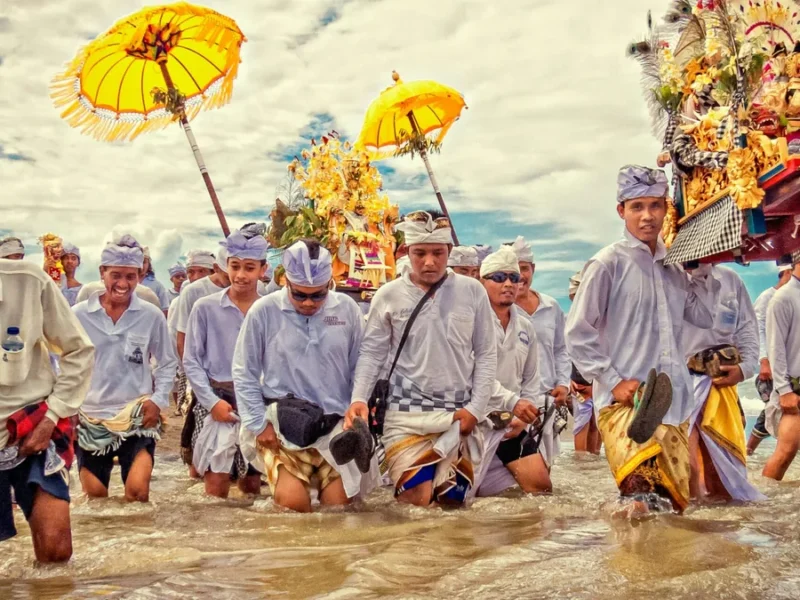 Lao cultural procession representing a founder-hosted journey through Laos and Southeast Asia.
